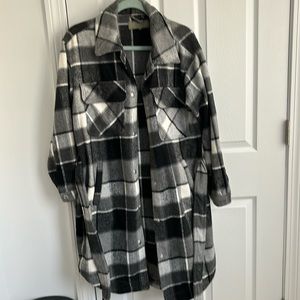 Medium BlankNYC jacket with tie around the waist.